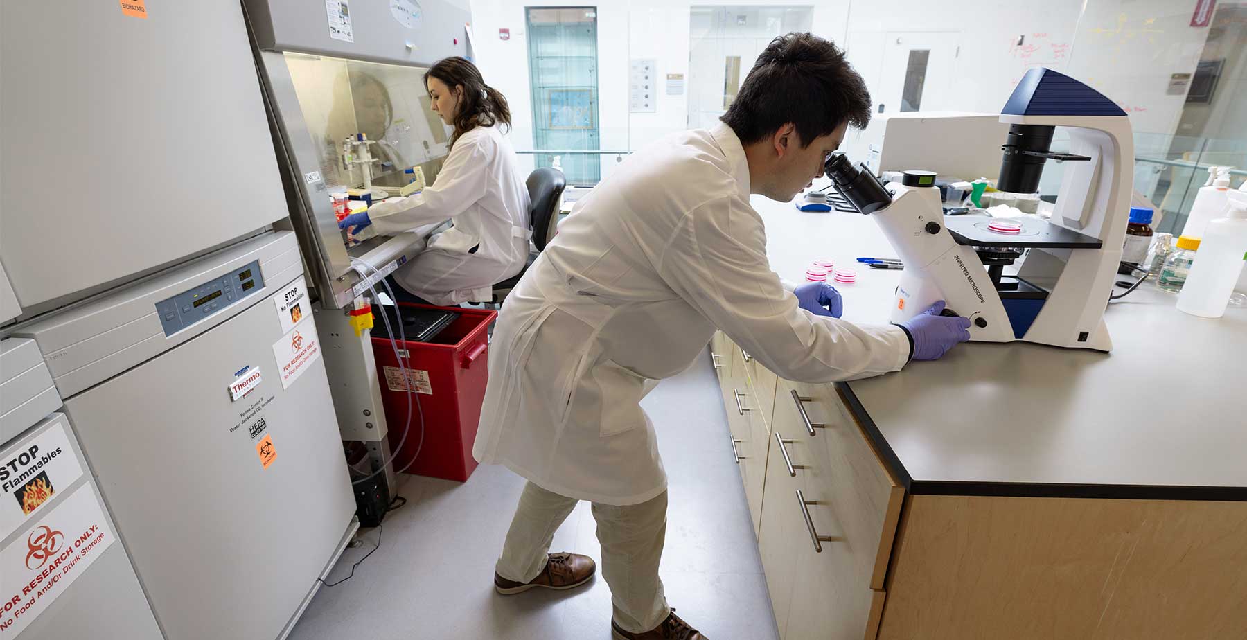 Student researchers in a lab at the USA Health Mitchell Cancer Institute 