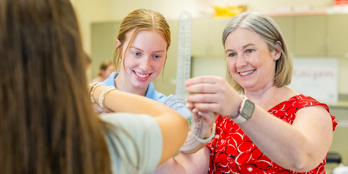 Two women working with patient