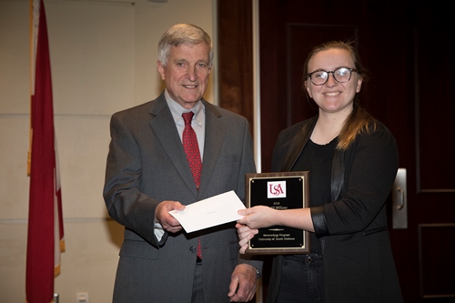 Dr. Bill Williams presents an Endowment Scholarship to Ashlyn Shirey.