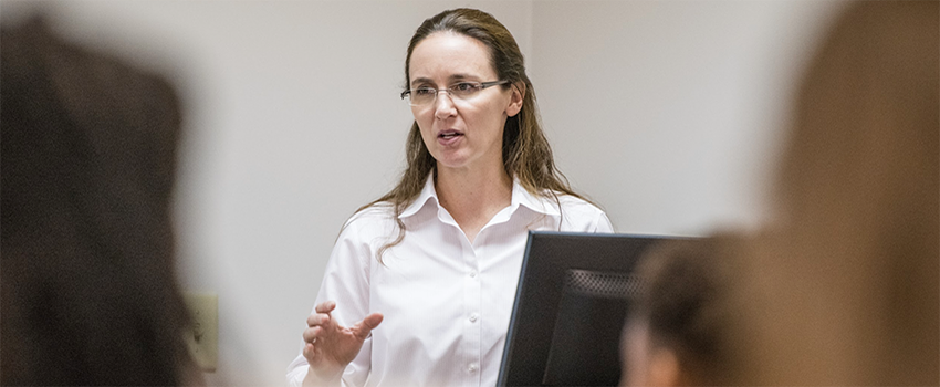 Brooke Forrester teaching in front of class