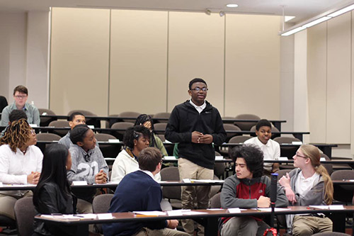 Student speaking in classroom.