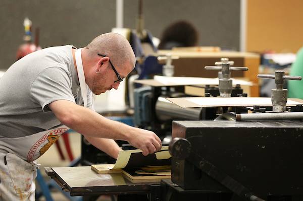 Male student working in art studio