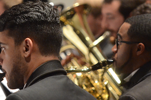 Students playing their instruments in a concert.