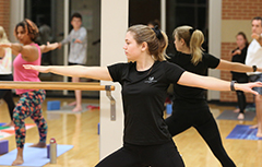 Instructor leading yoga class