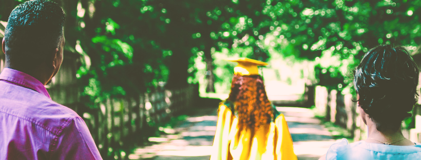 Graduate walking away from parents