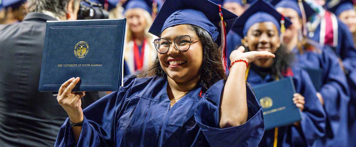 south alabama graduate posing with her diploma