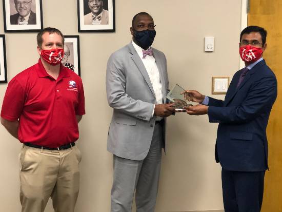 eft to Right: Dr. John Cleary, USA Faculty Senate President; Chresal Threadgill, Mobile County Public School System (MCPSS) Superintendent; Dr. Delwar Hossain, USA Department of Communication.