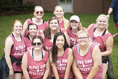 Female students standing outside during move in