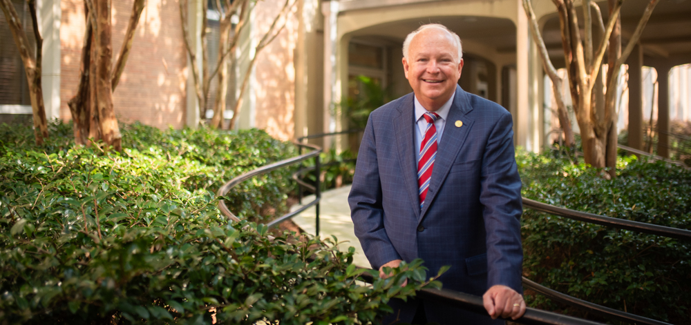 President Jo Bonner standing in front of Admin building outside.