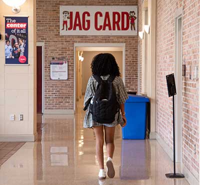Student walking to get Jag Card in Student Center.